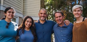 From left to right: Sakshina Bhatt, Samantha Chacon, Adam Lichtenheld, Jeremy Weinstein, and Savanna Honerkamp-Smith pose at a farewell gathering for Dr. Weinstein.
